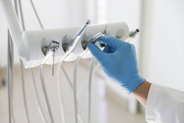 Professional Tooth Extraction technician working in Houston, AK